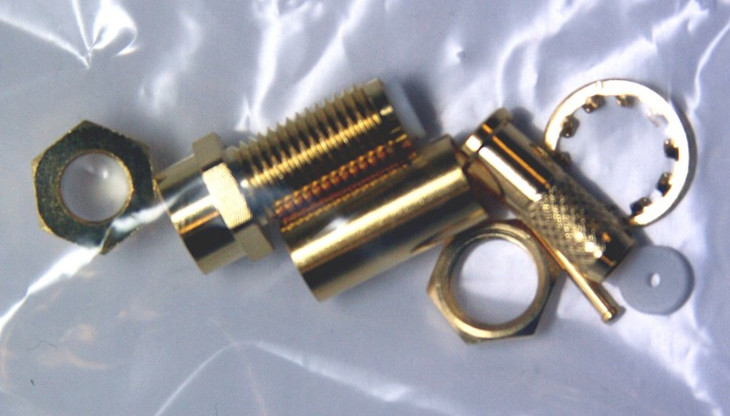 SMA-Reverse Kupplung für RG58, Crimp, vergoldet